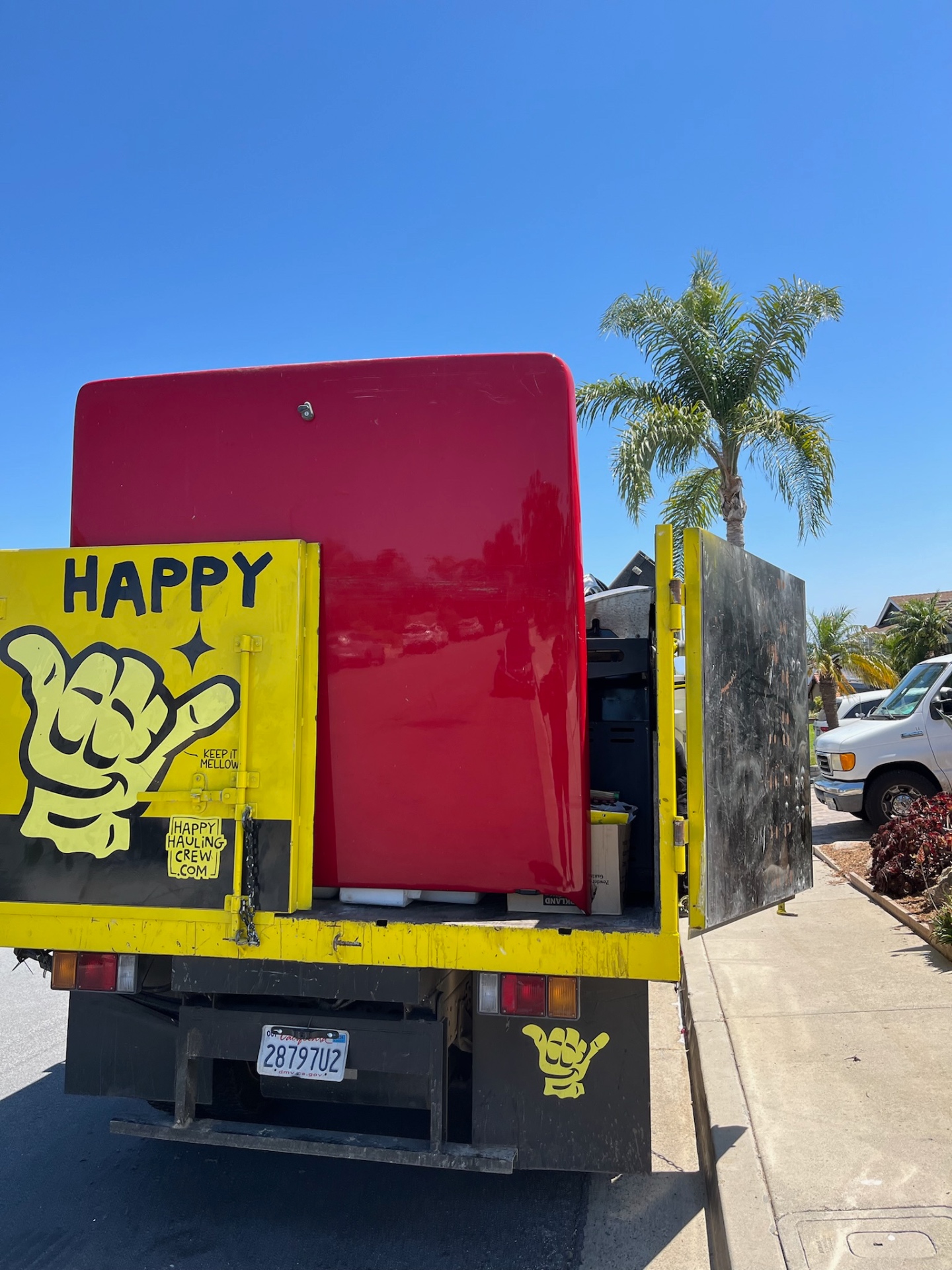 Appliances loaded for recycling — metal, motors, and components all separated